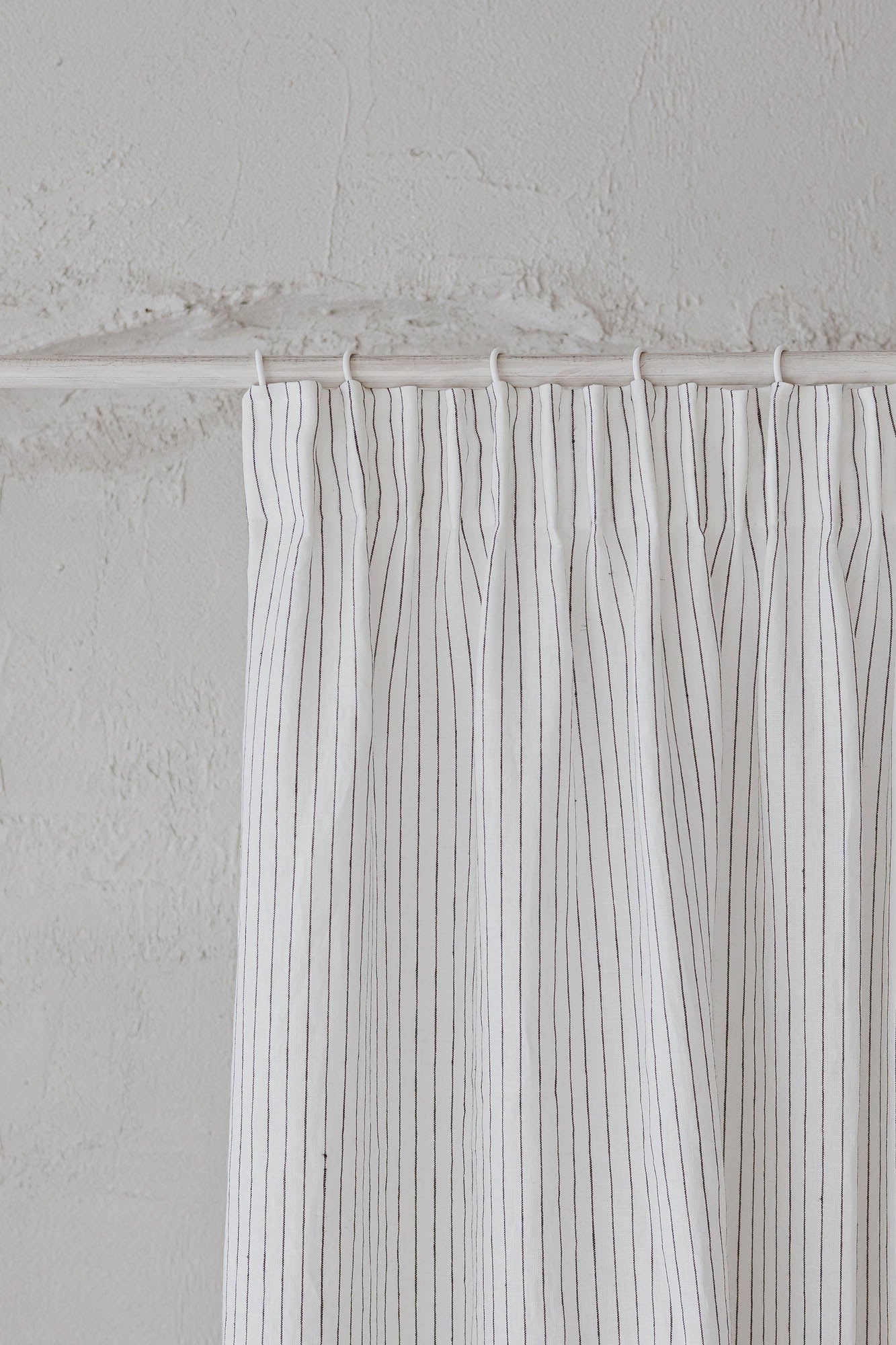 Pencil pleat linen curtain in white with black stripes
