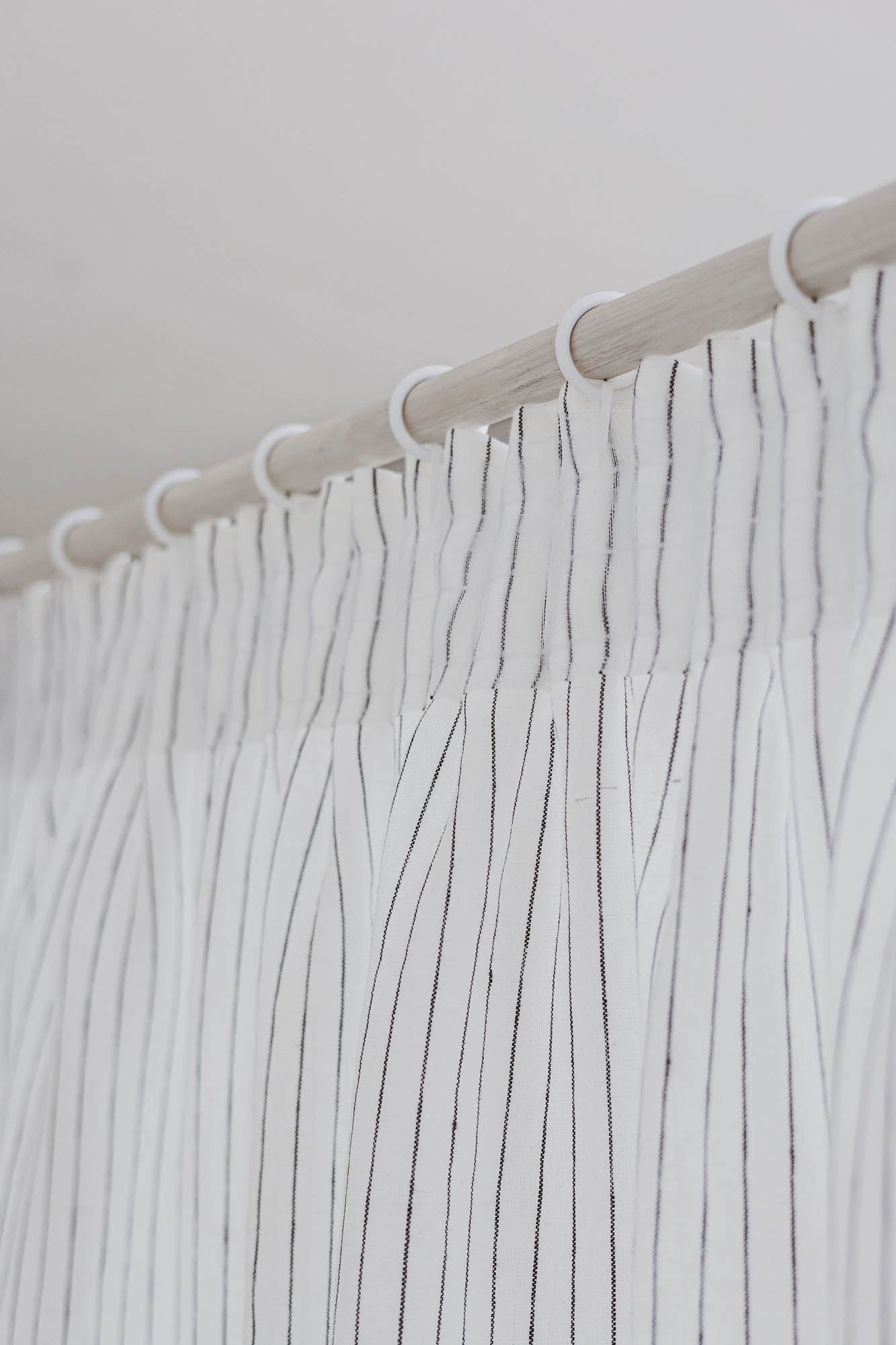 Pencil pleat linen curtain in white with black stripes