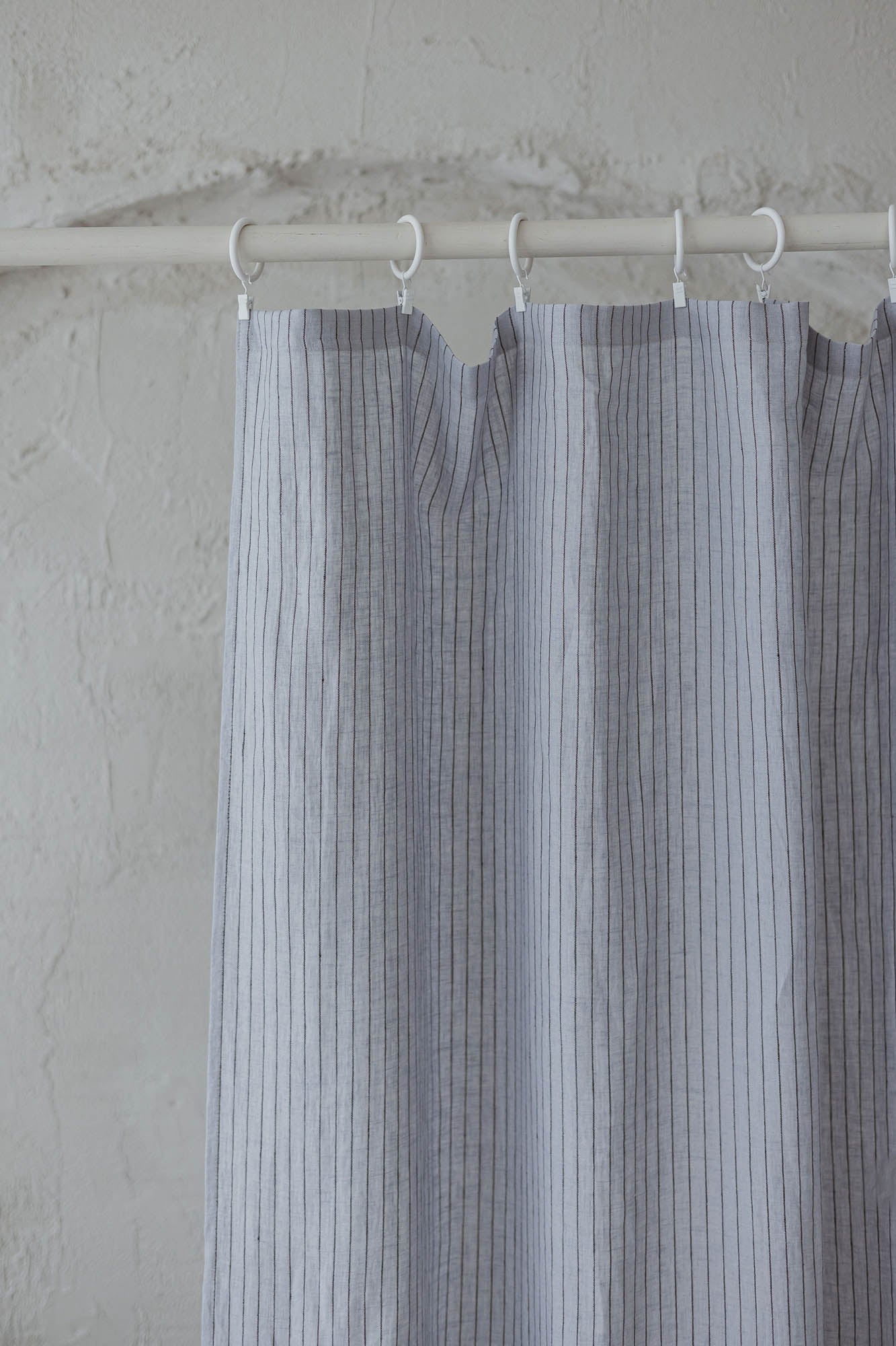 Grey linen curtain with black stripes and simple hem, for clips