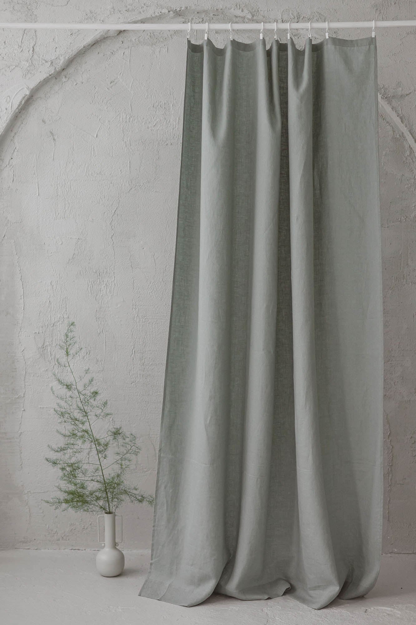Frosty green linen curtain with simple hem, for clips