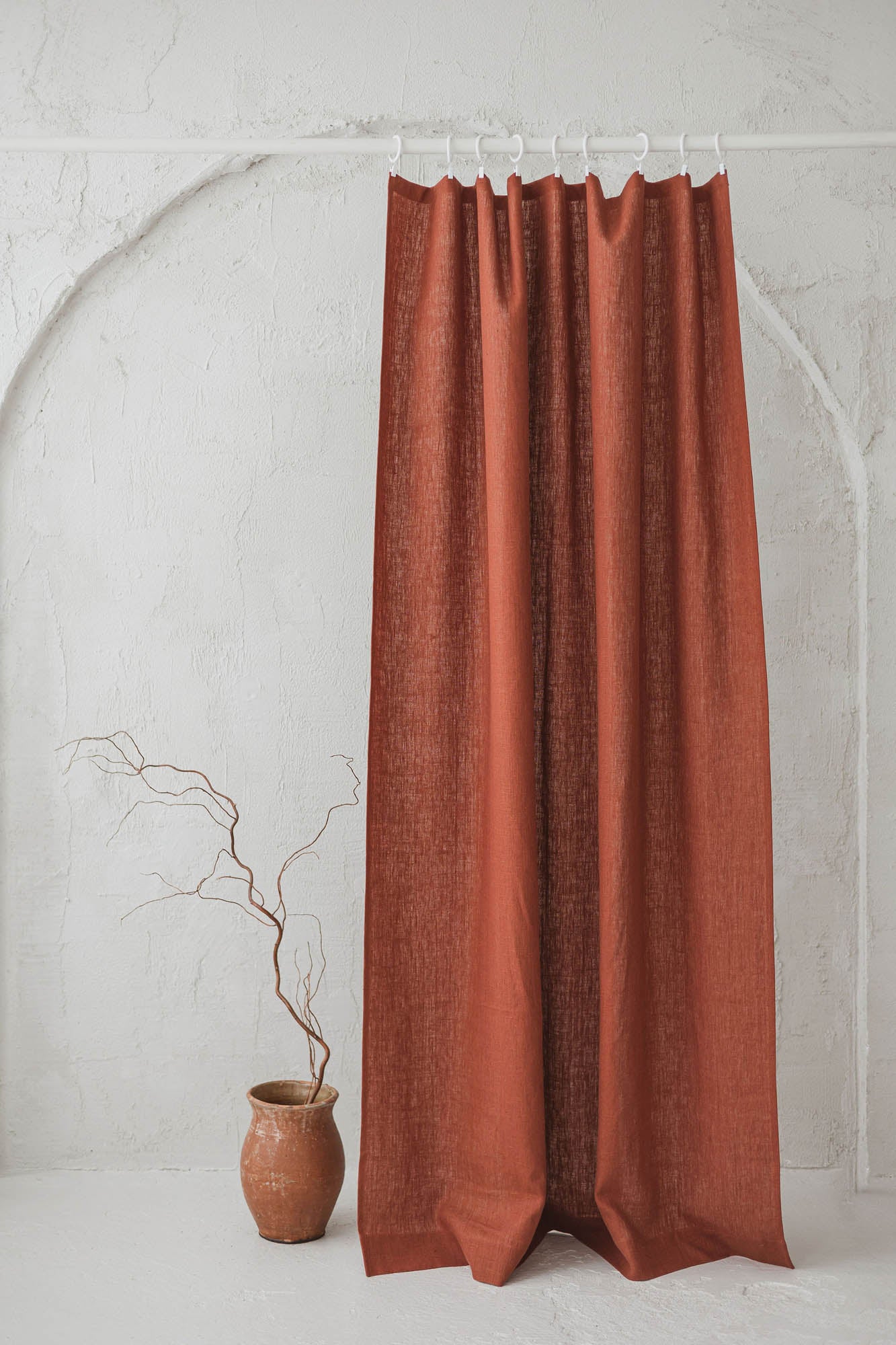 Heavyweight burnt orange linen curtain with simple hem, for clips