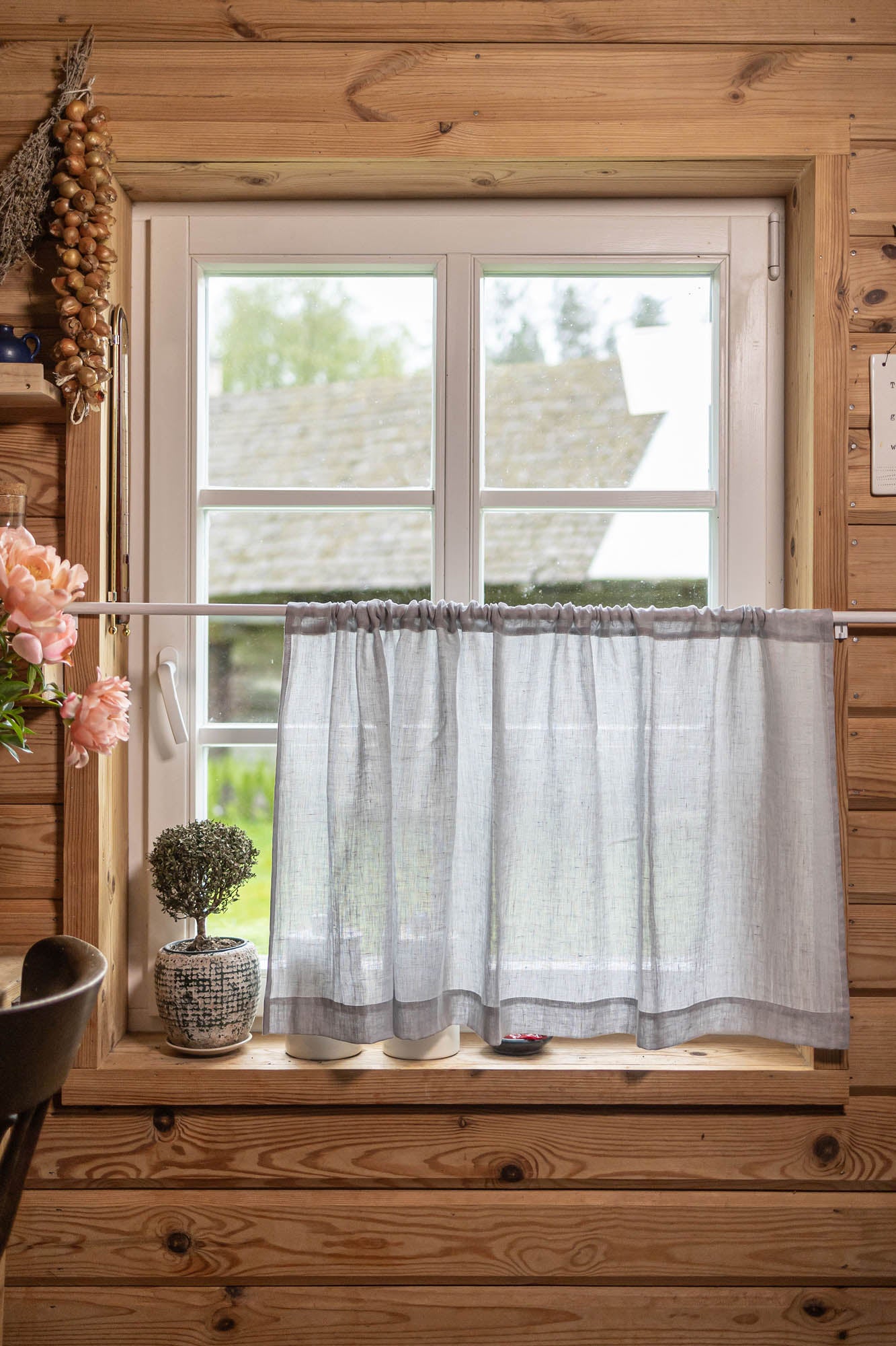 Sheer linen cafe curtain in rainy day