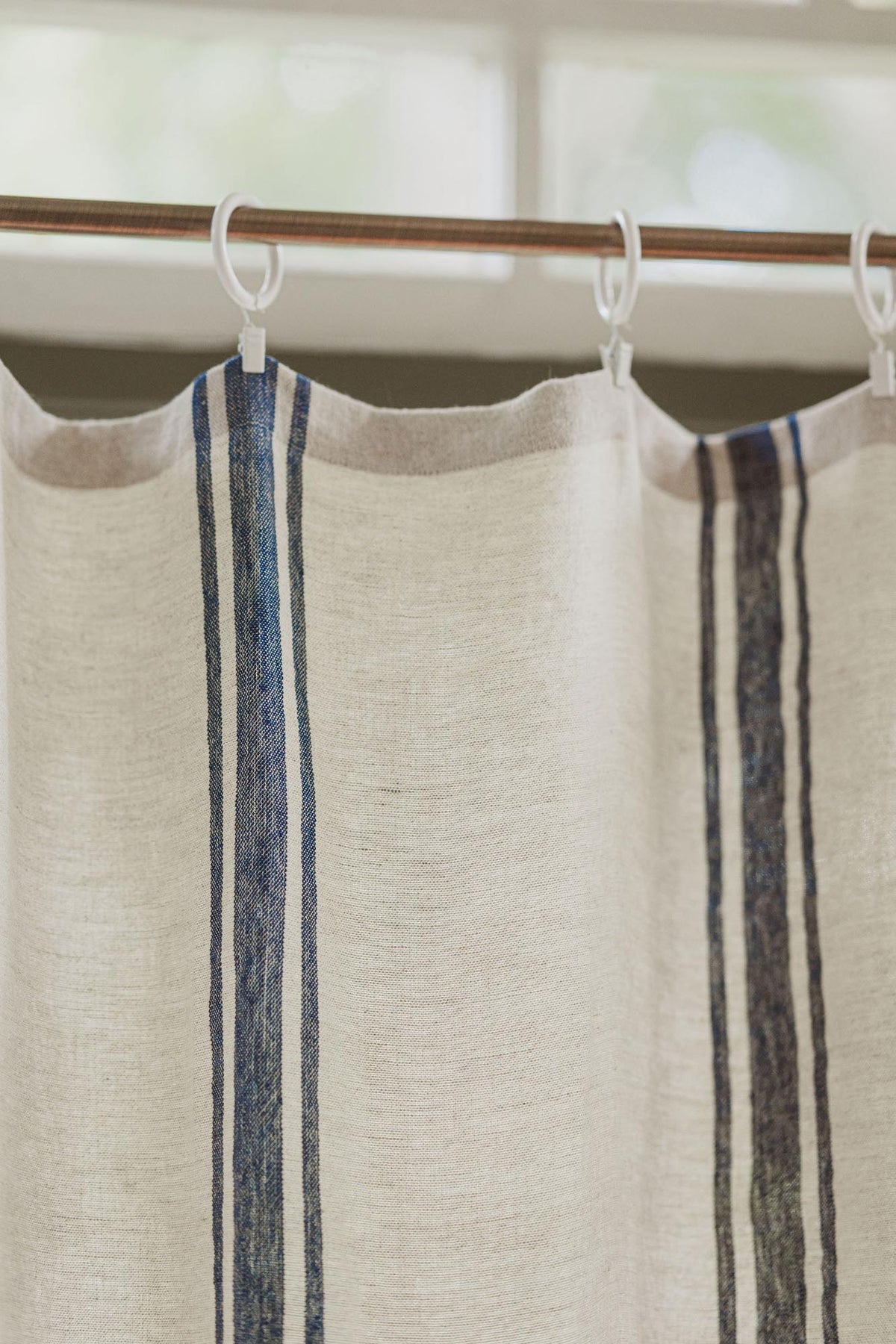 Linen curtain with classic blue stripes and simple hem, for clips