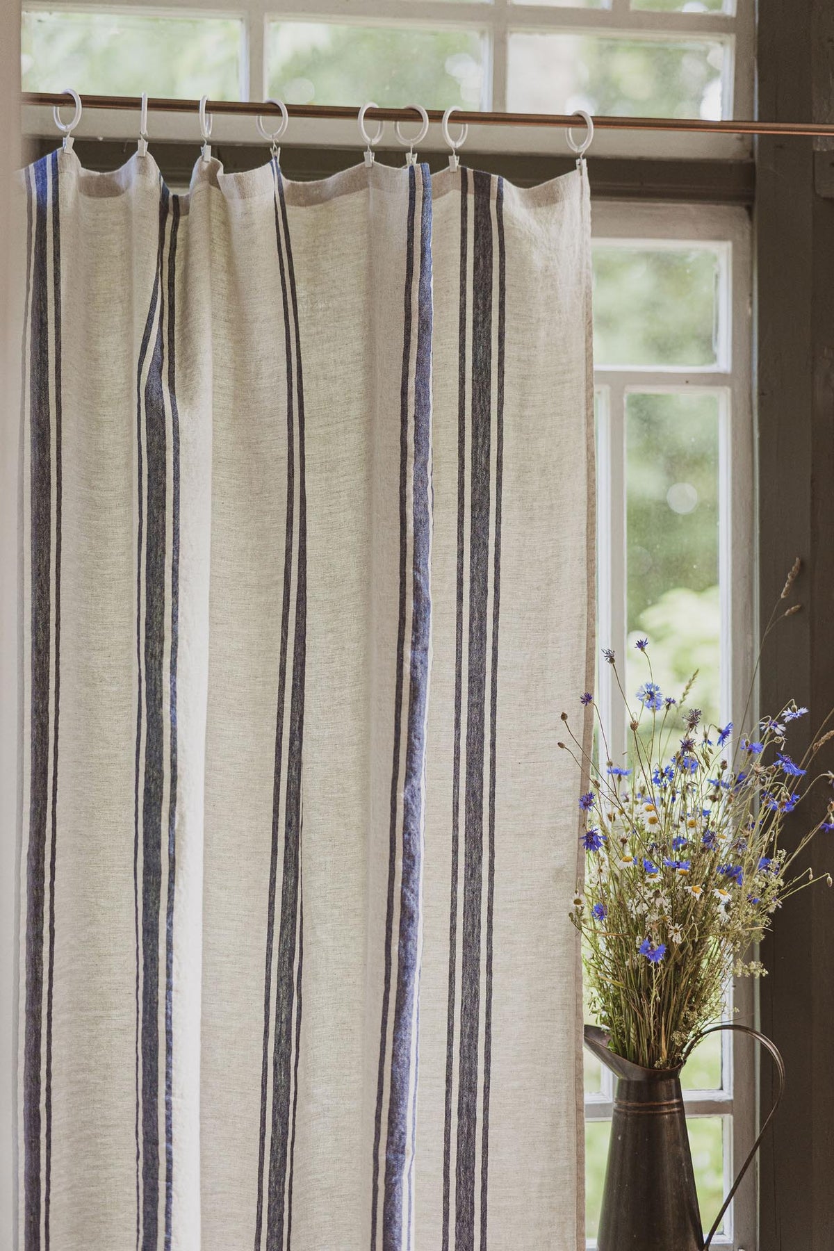 Linen curtain with classic blue stripes and simple hem, for clips