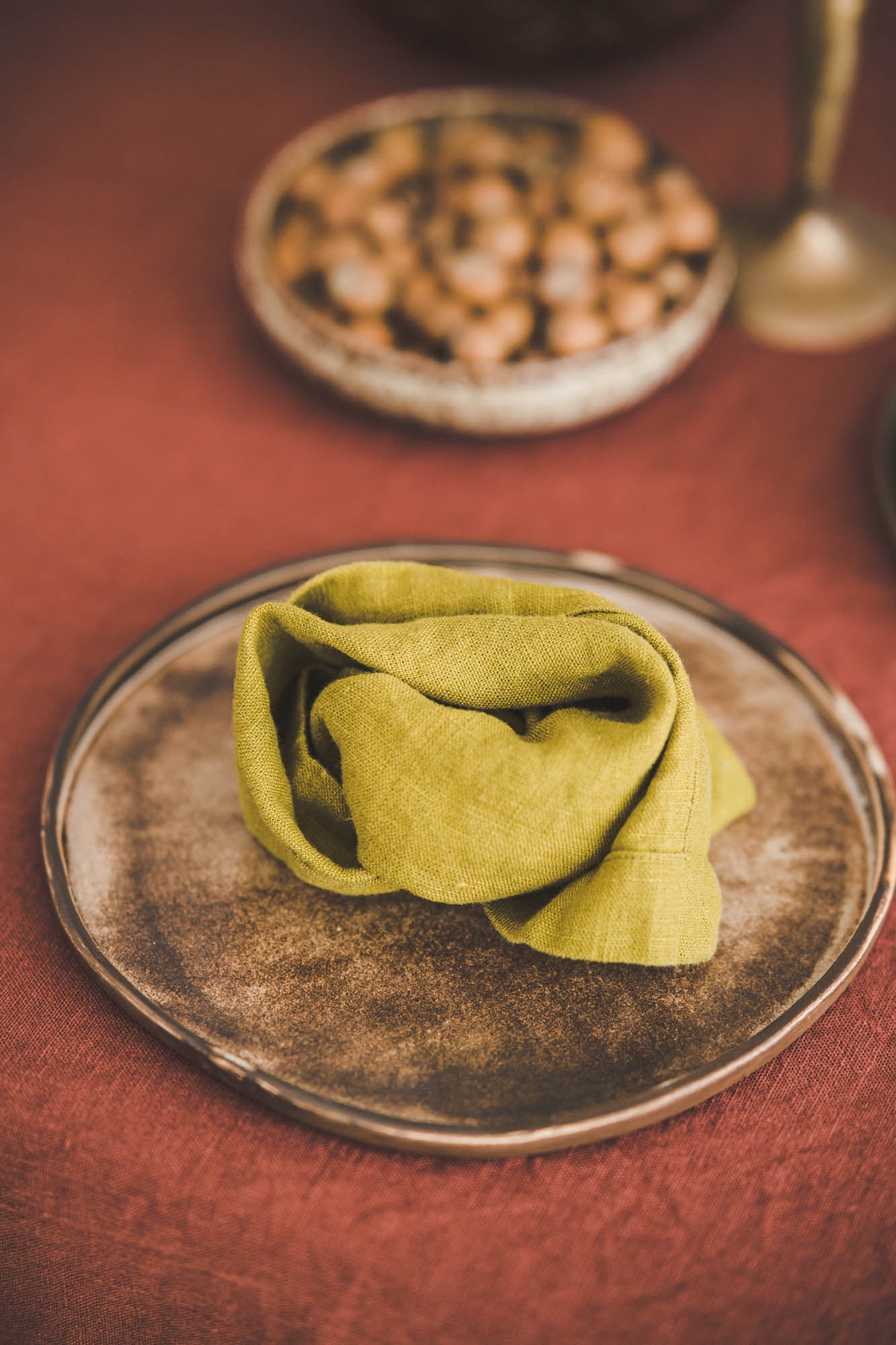 Olive green linen napkins with mitered corners