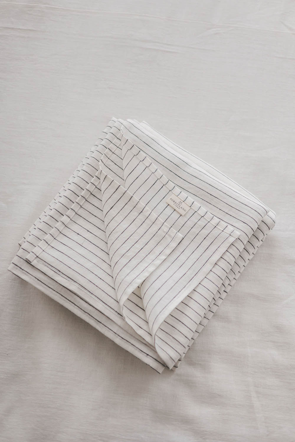 White linen flat sheet with black stripes