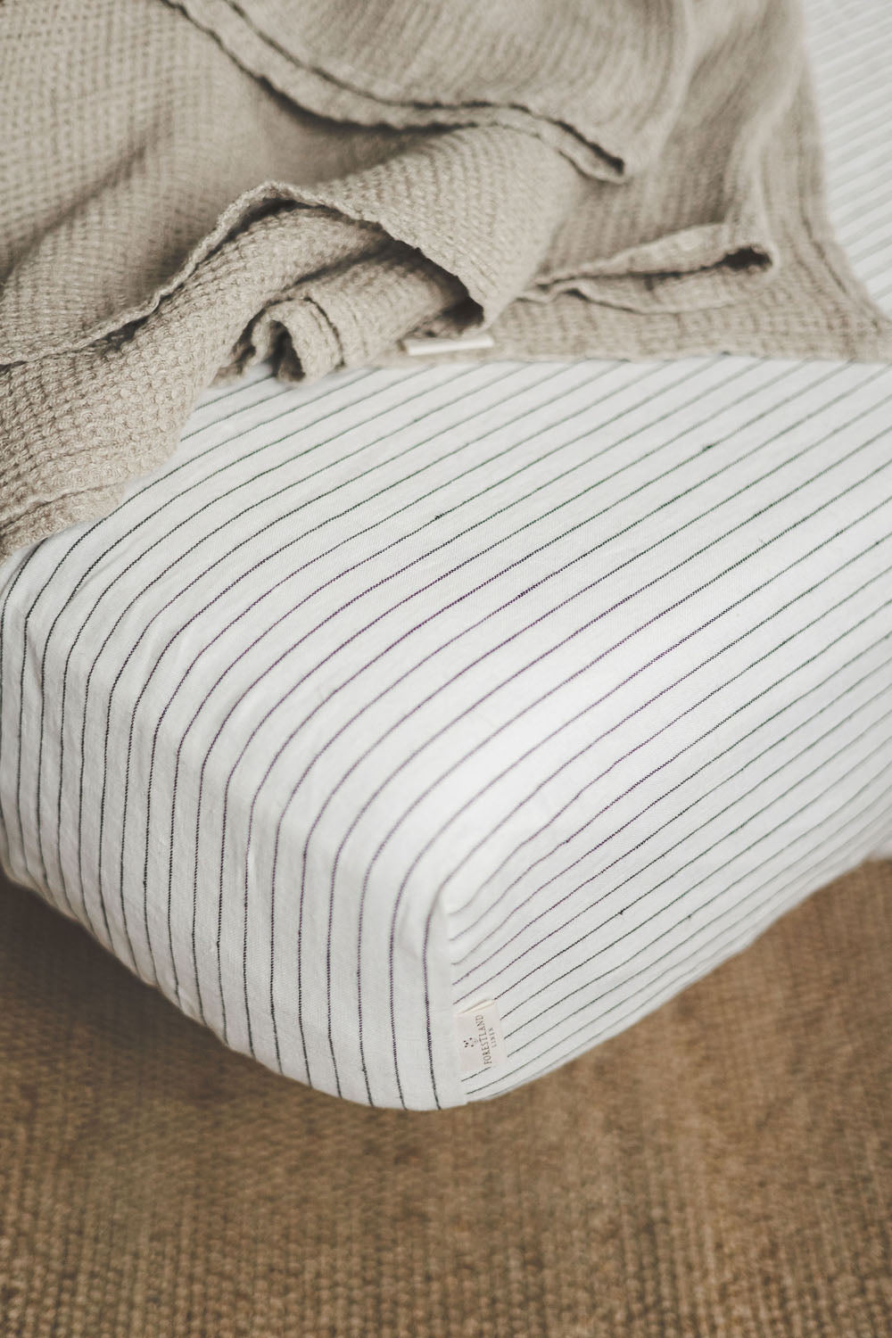 White linen fitted sheet with black stripes