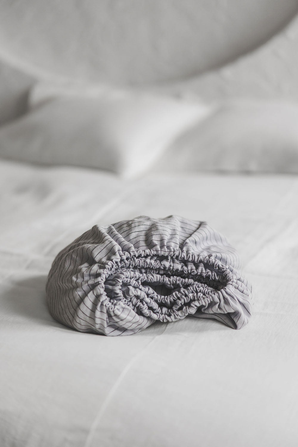 Grey linen fitted sheet with black stripes