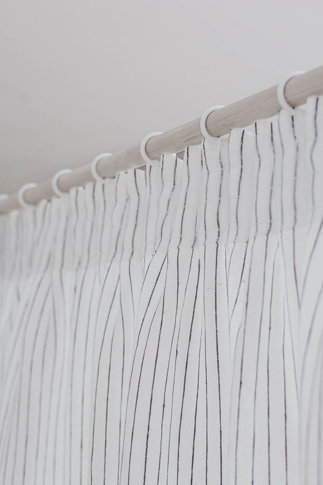 Pencil pleat linen curtain in white with black stripes