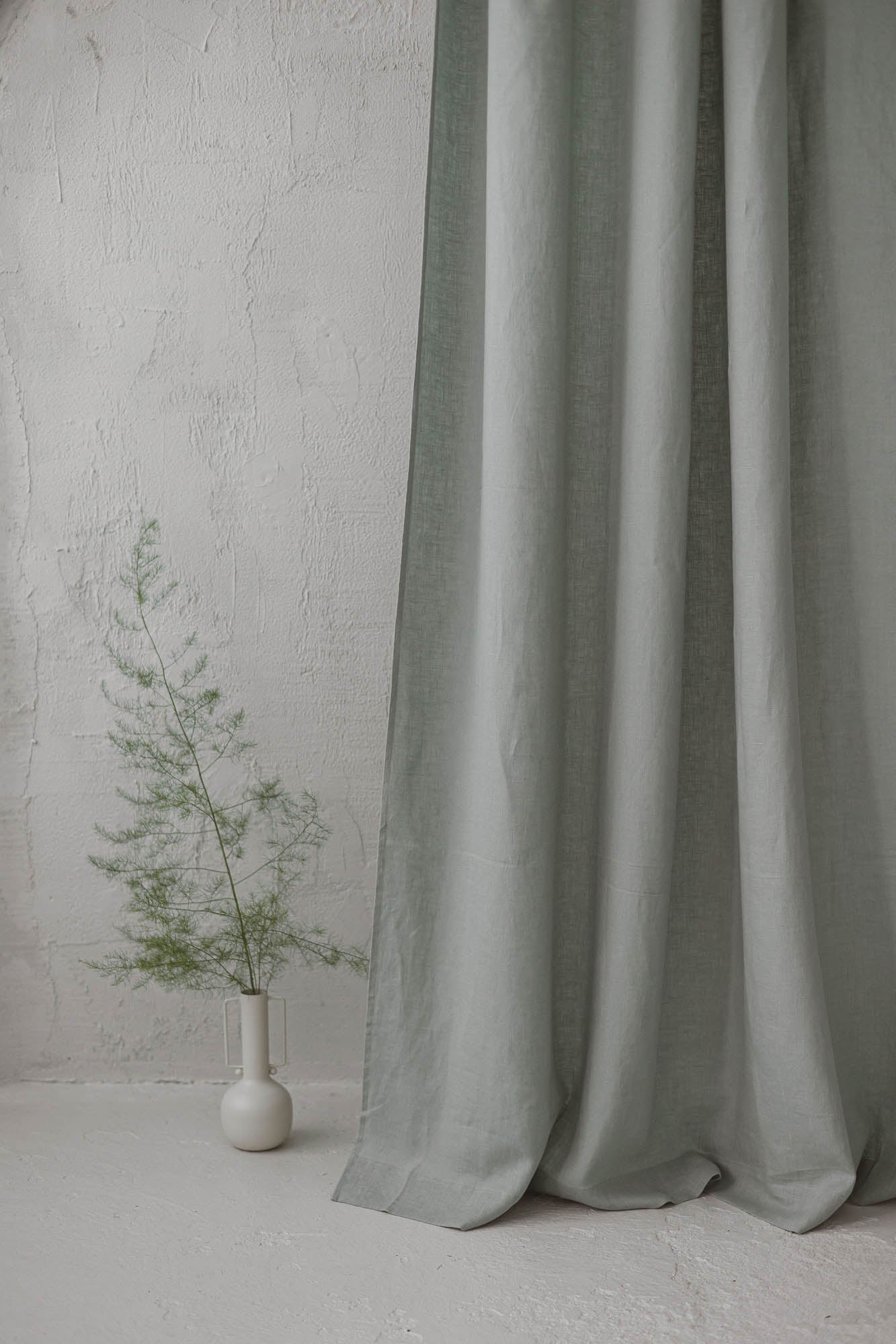Frosty green linen curtain with simple hem, for clips