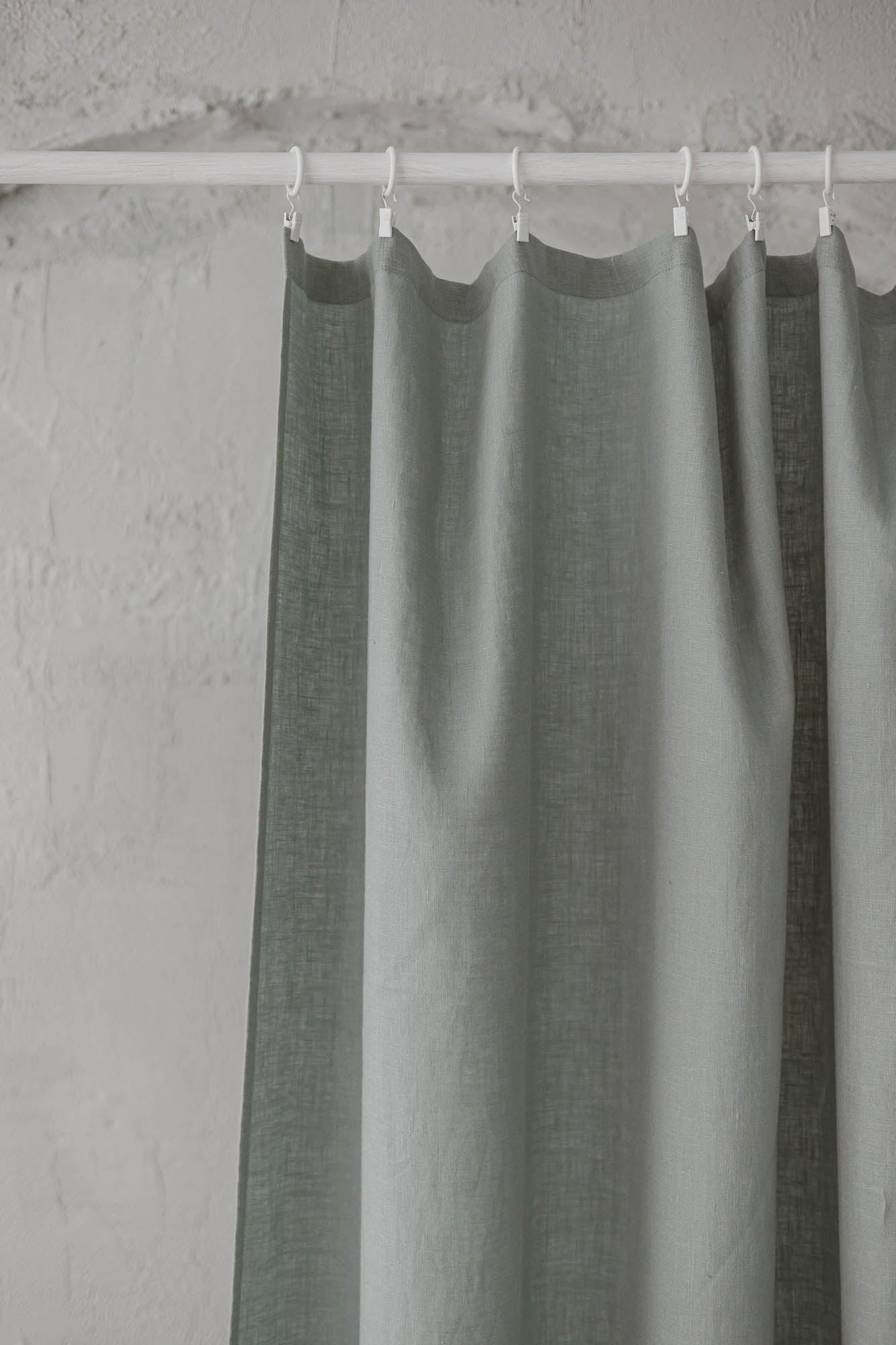 Frosty green linen curtain with simple hem, for clips
