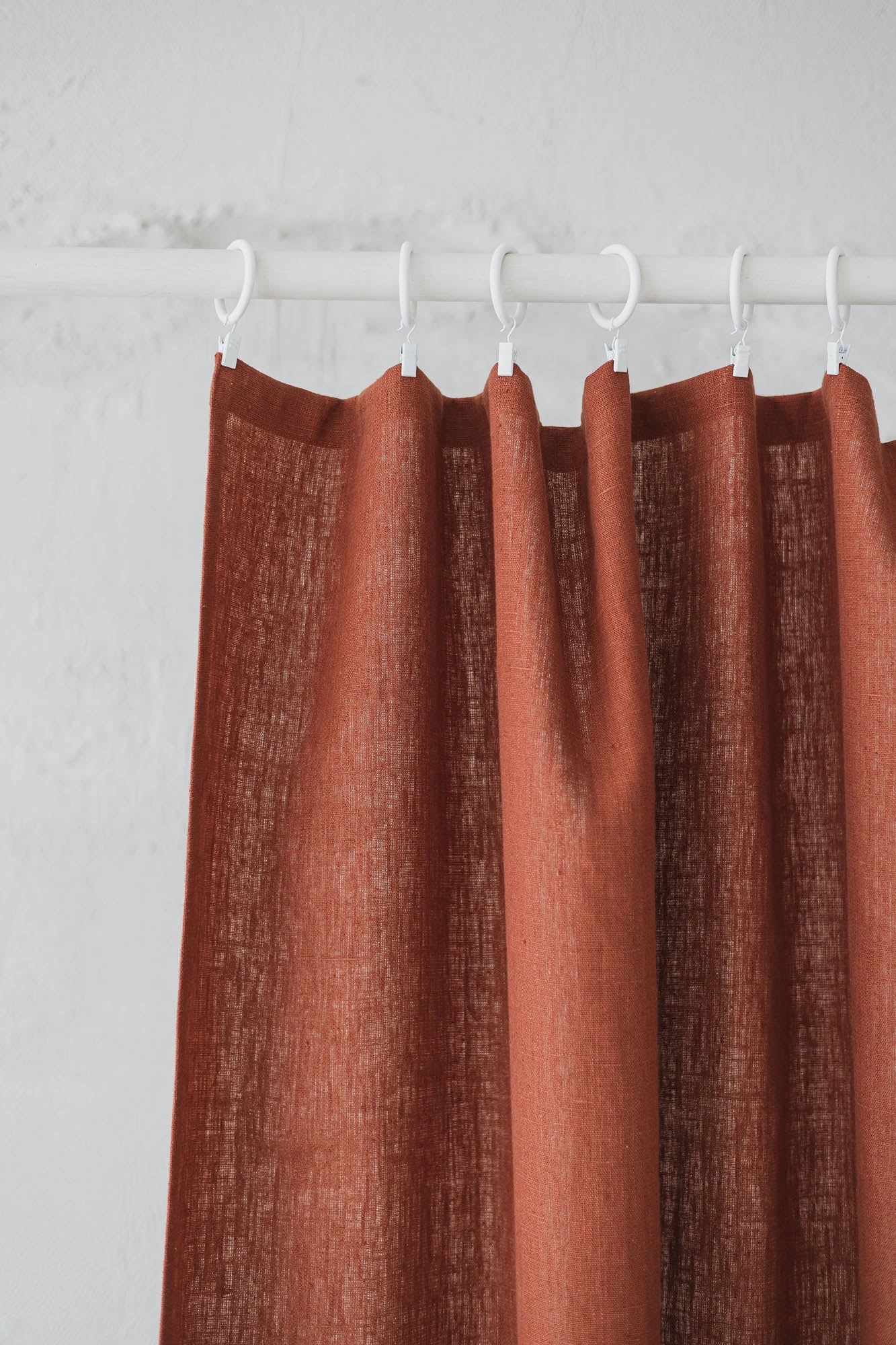Heavyweight burnt orange linen curtain with simple hem, for clips