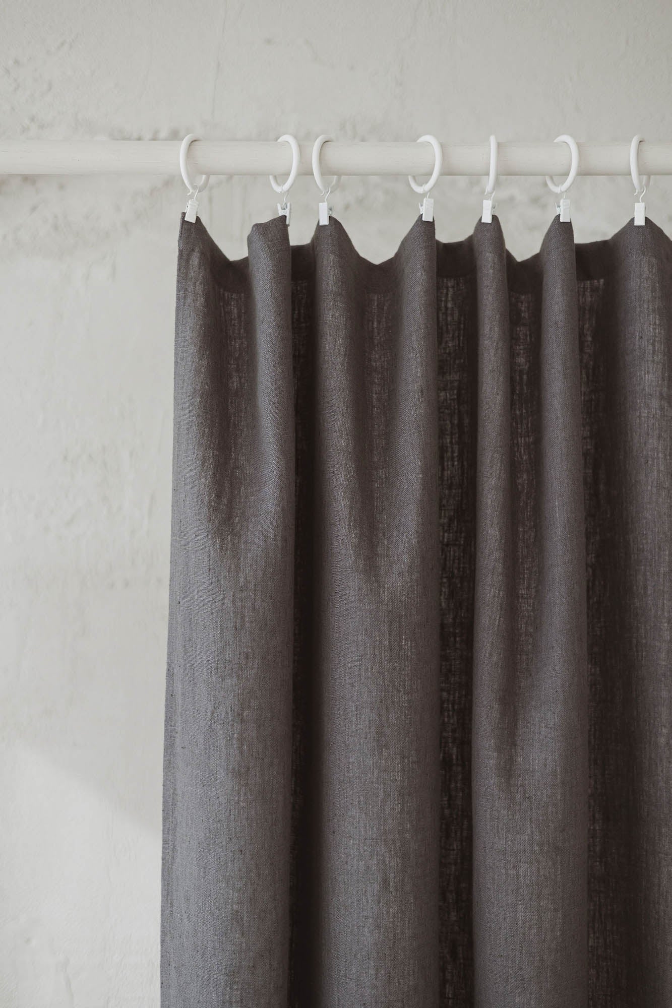 Heavyweight charcoal gray linen curtain with simple hem, for clips