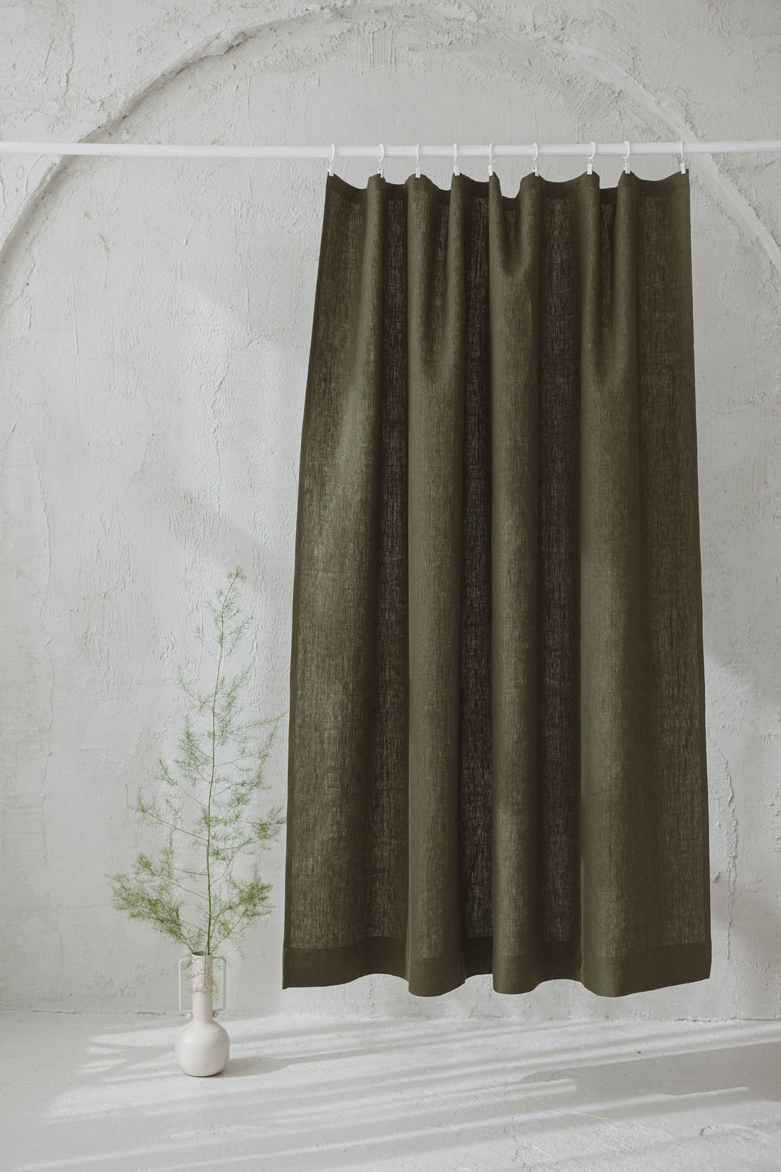Heavyweight forest green linen curtain with simple hem, for clips