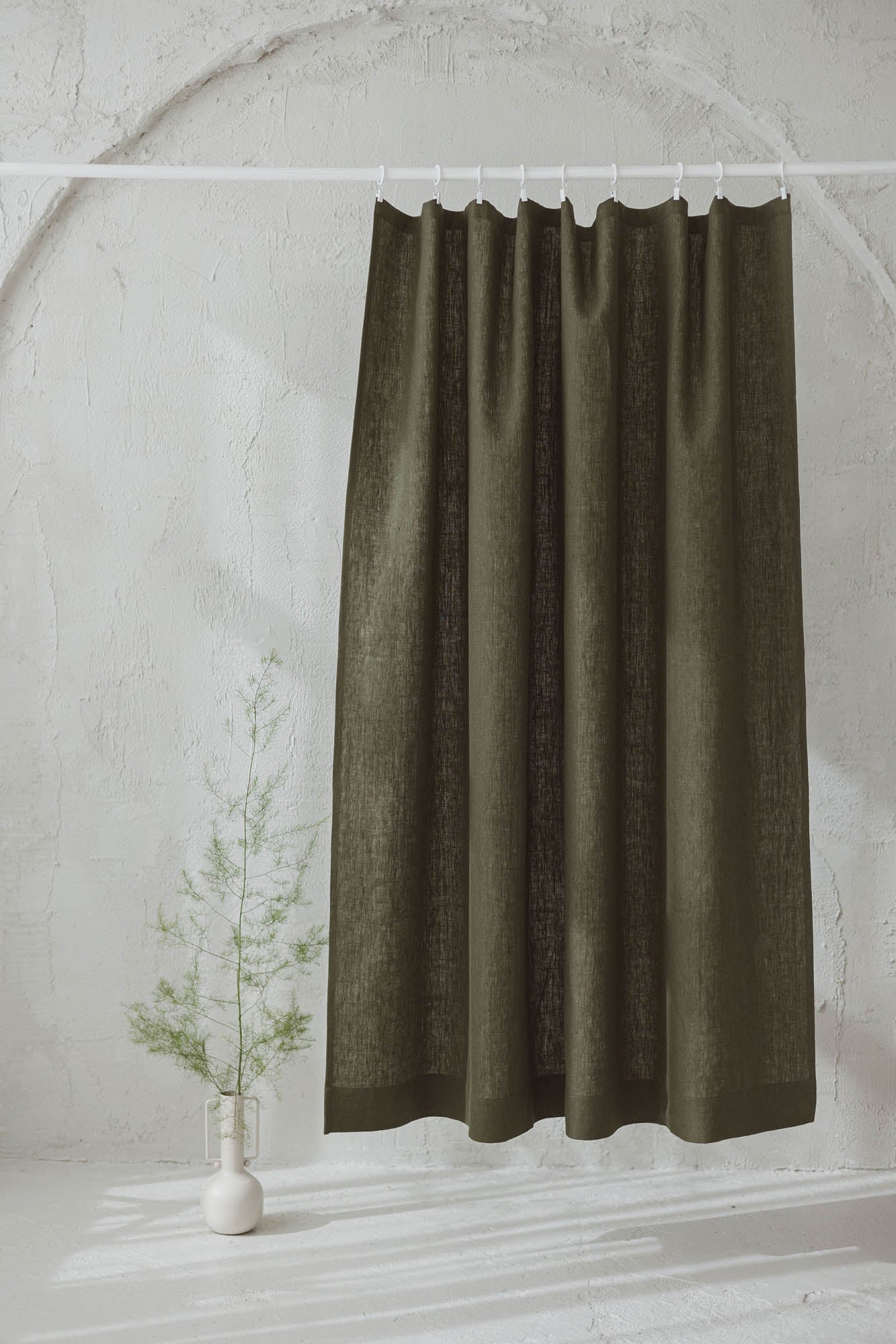Heavyweight forest green linen curtain with simple hem, for clips