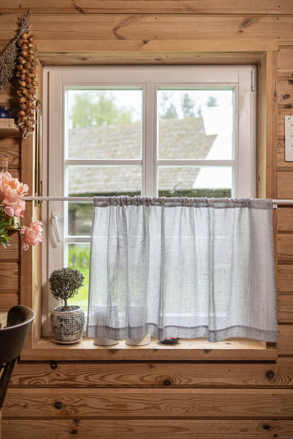 Sheer linen cafe curtain in rainy day
