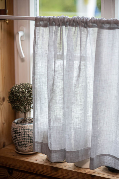 Sheer linen cafe curtain in rainy day