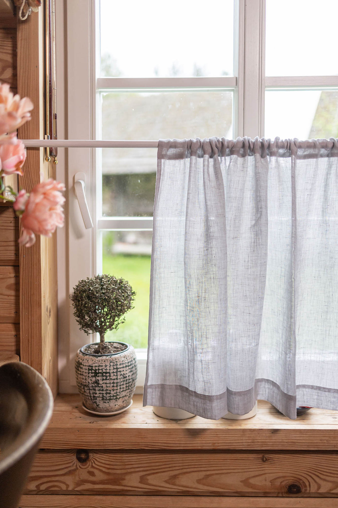 Sheer linen cafe curtain in rainy day