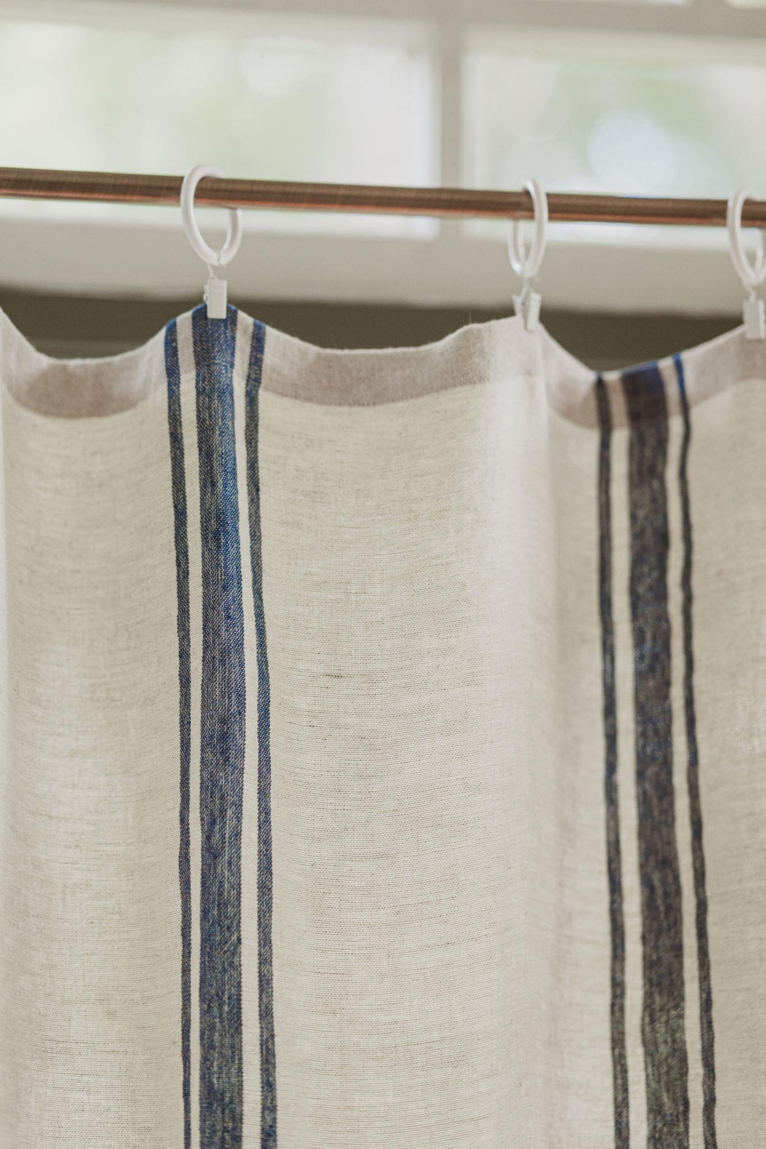 Linen curtain with classic blue stripes and simple hem, for clips