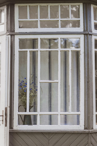 Linen curtain with classic blue stripes and simple hem, for clips