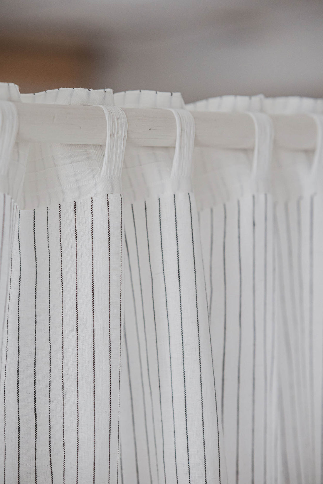 White and black striped linen curtain with multifunctional heading tape