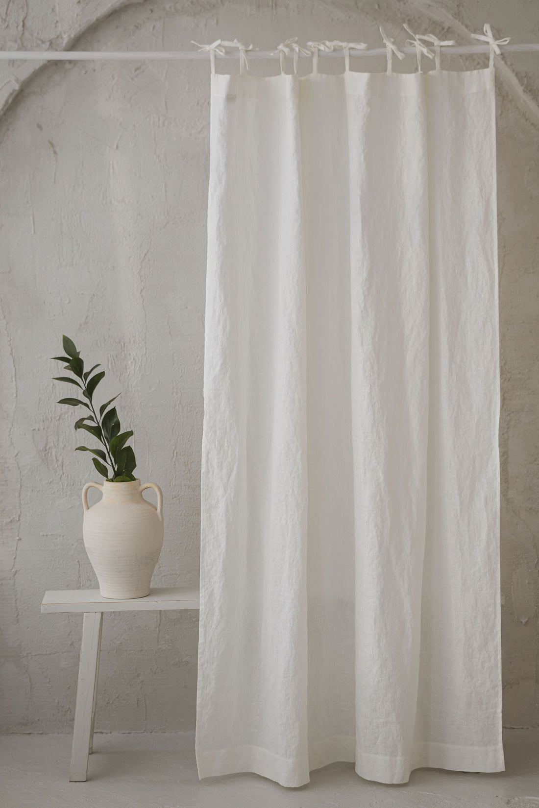 Tie top off white linen curtain