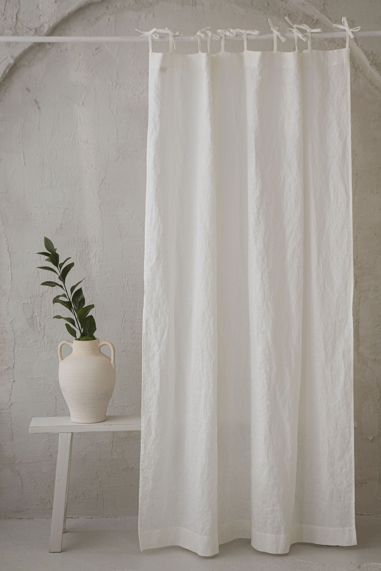 Tie top off white linen curtain