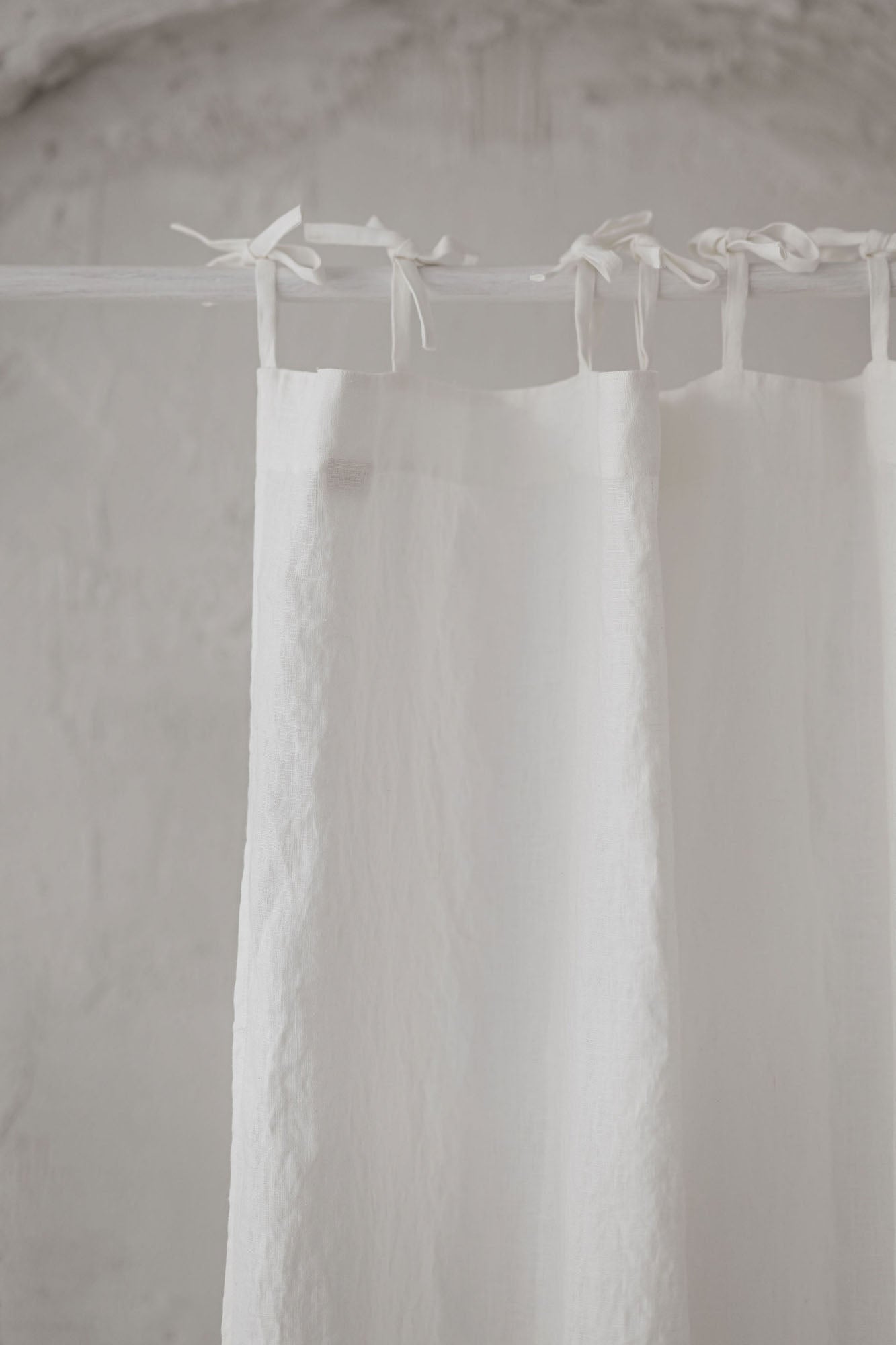 Tie top off white linen curtain