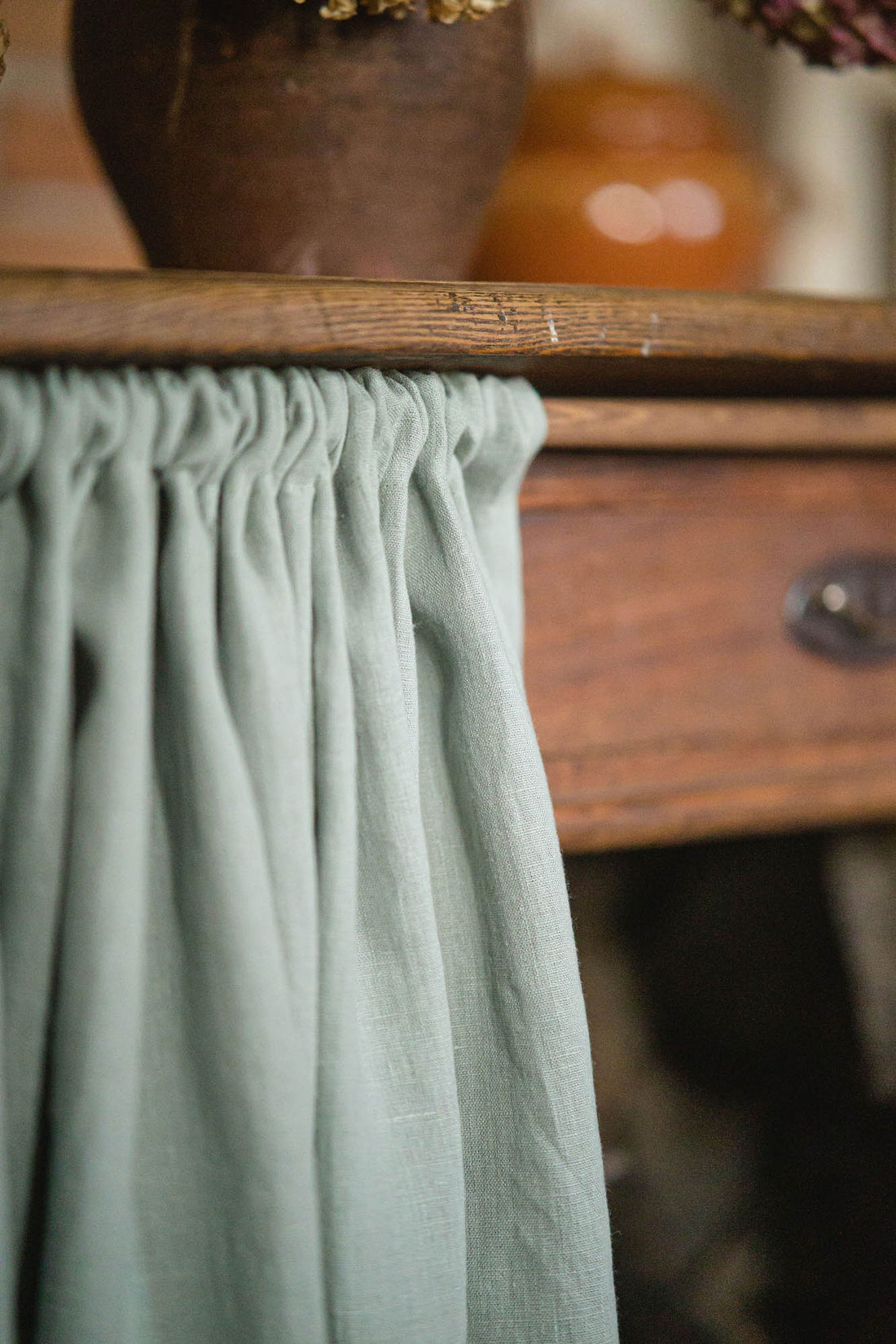 Frosty green linen cabinet curtain