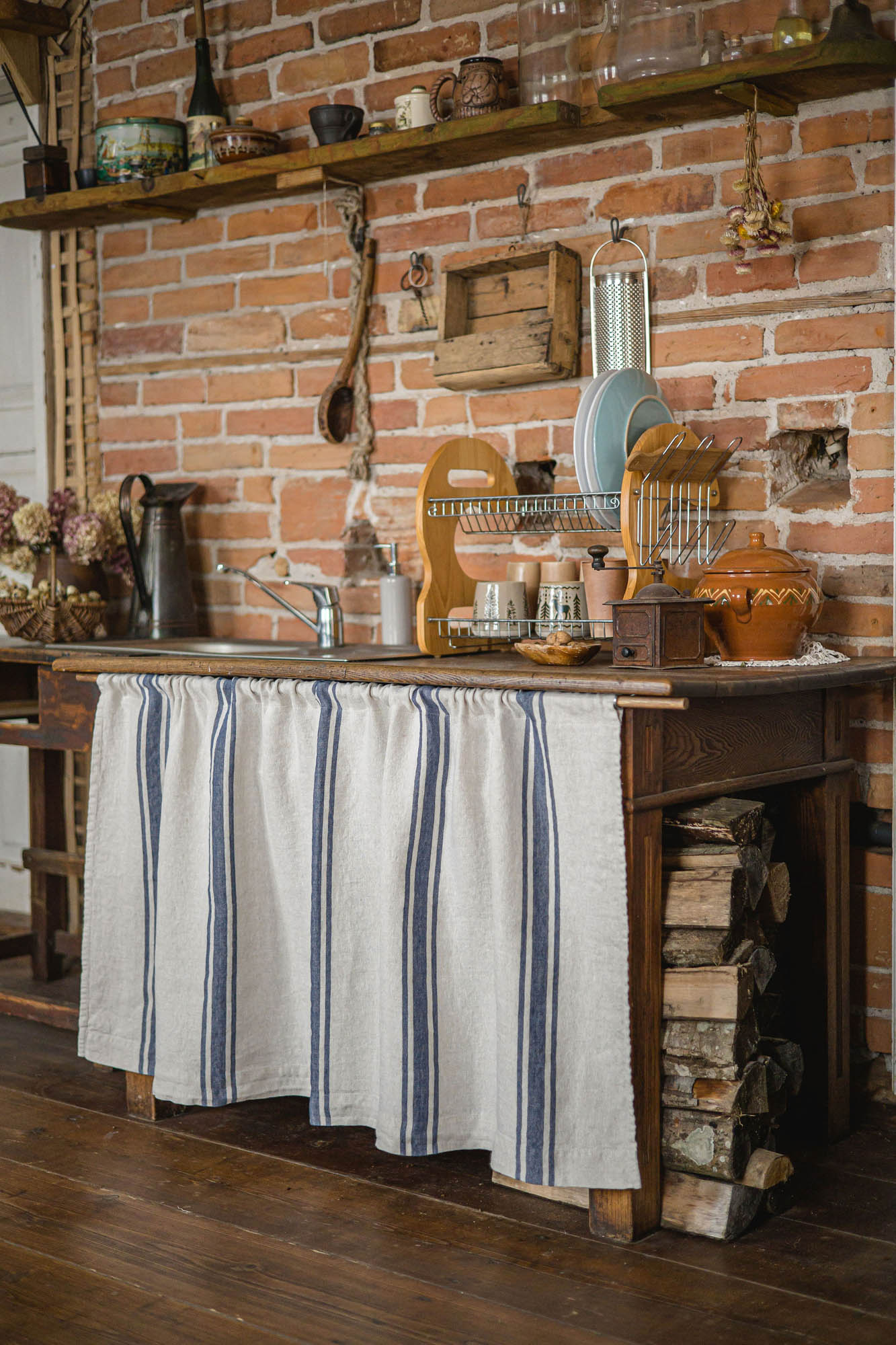 Linen cabinet curtain with blue stripes