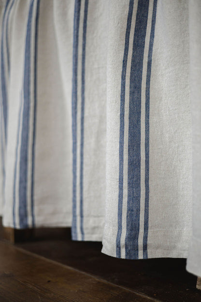 Linen cabinet curtain with blue stripes