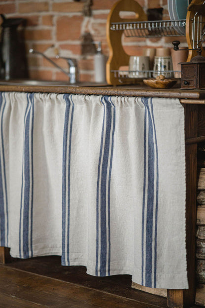 Linen cabinet curtain with blue stripes