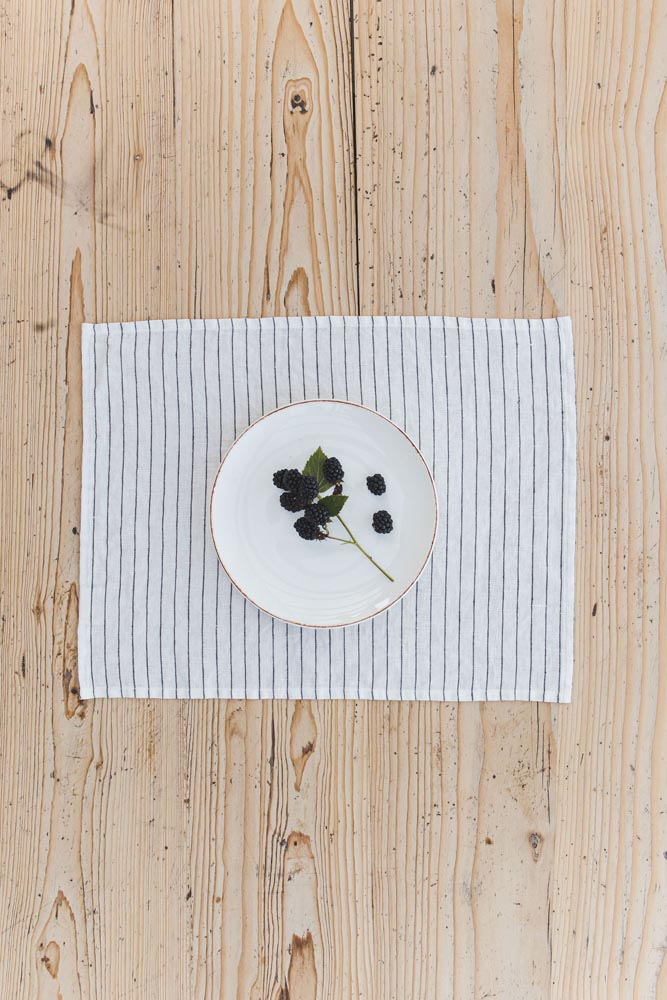 White linen placemats with black stripes