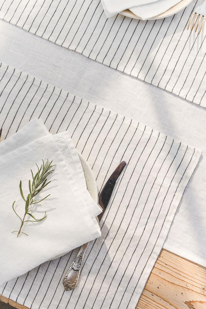 White linen placemats with black stripes