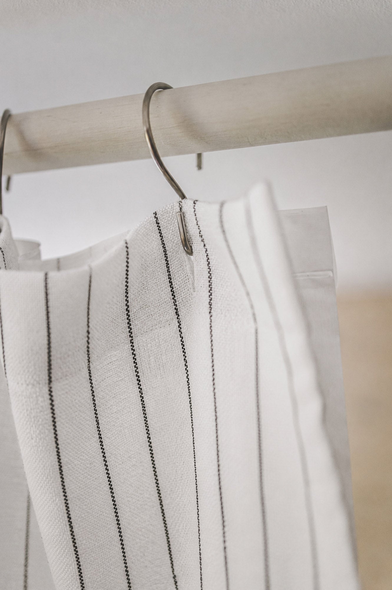 White linen shower curtain with black stripes