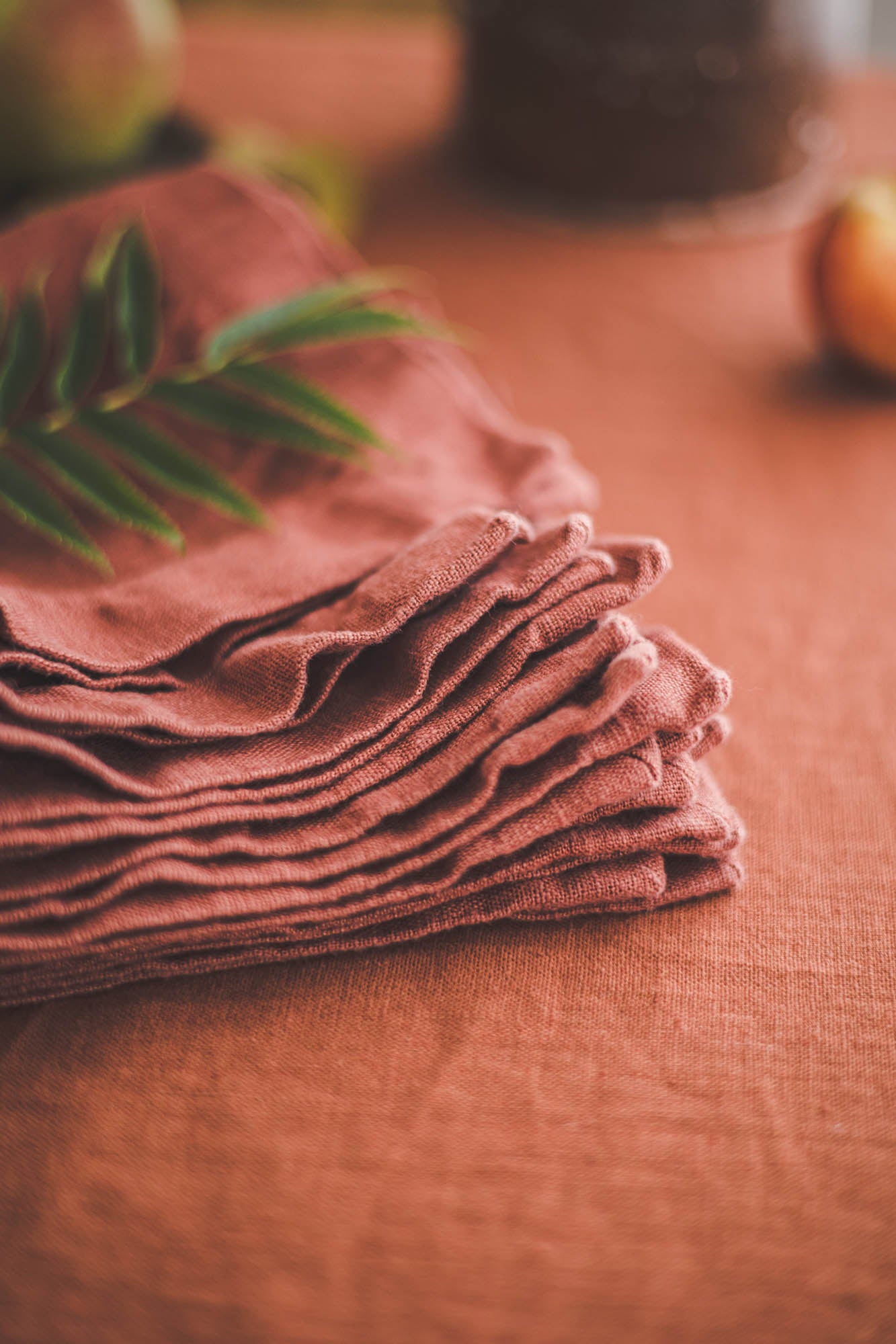Terracotta linen napkins with mitered corners