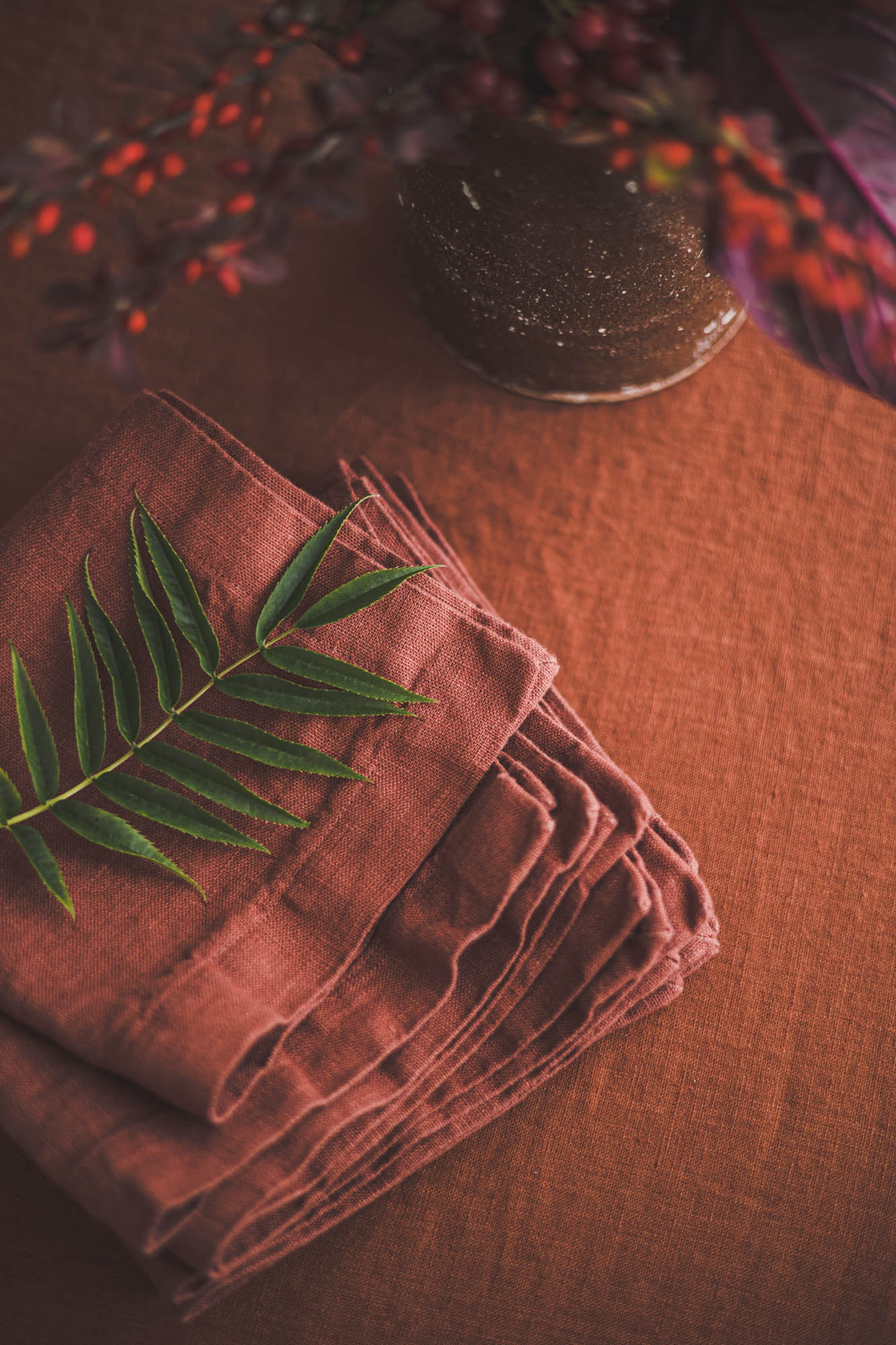 Terracotta linen napkins with mitered corners