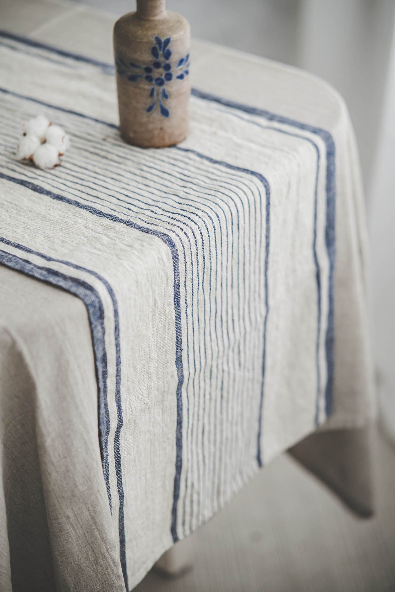Linen table runner with blue stripes