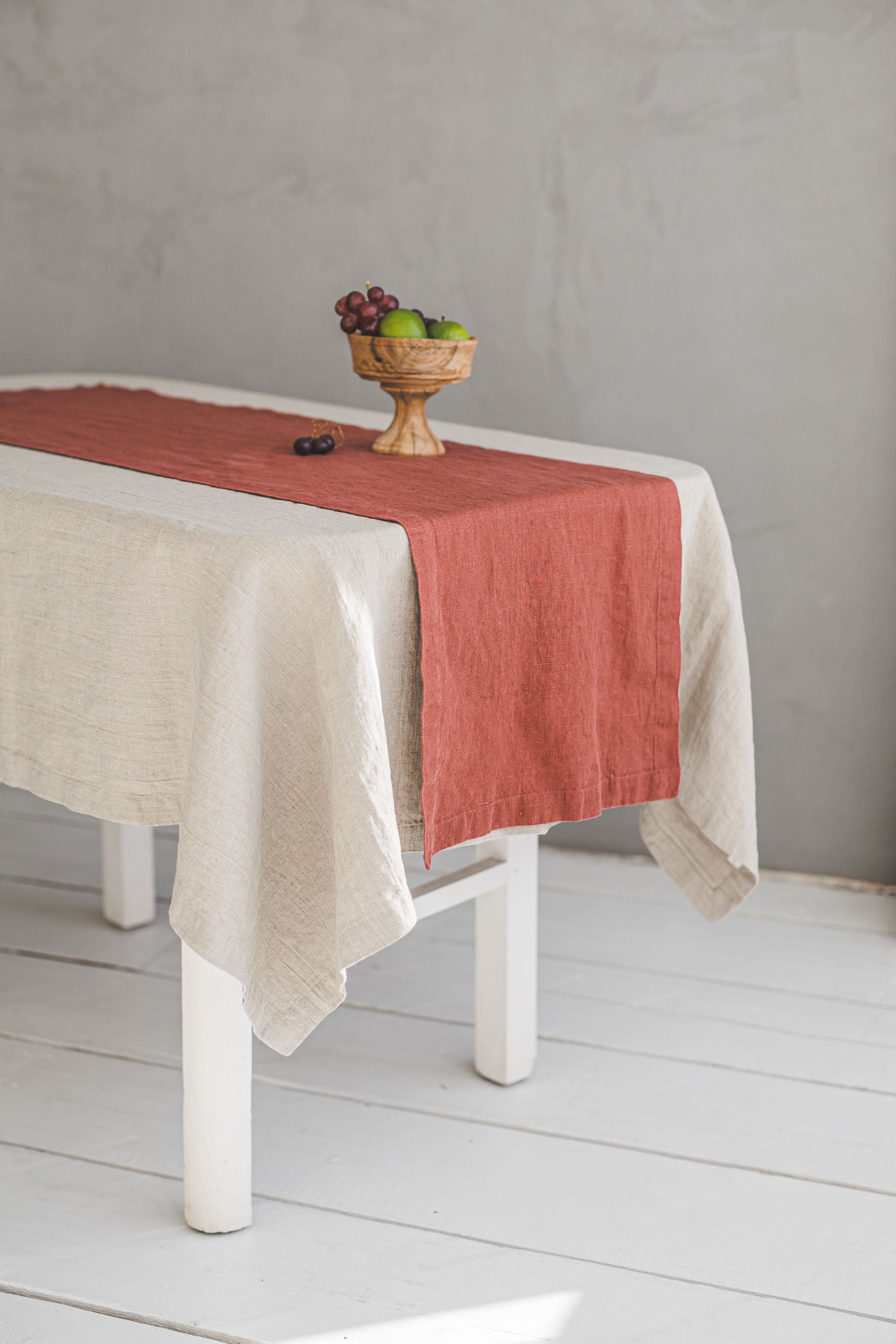 Terracotta linen table runner with mitered corners