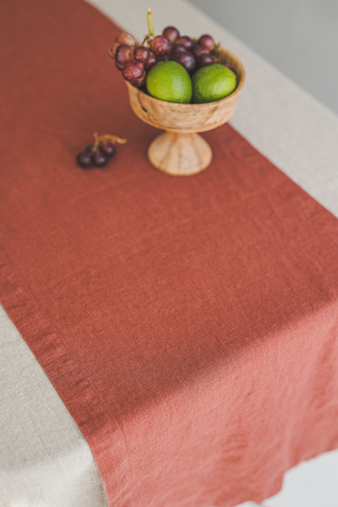 Terracotta linen table runner with mitered corners