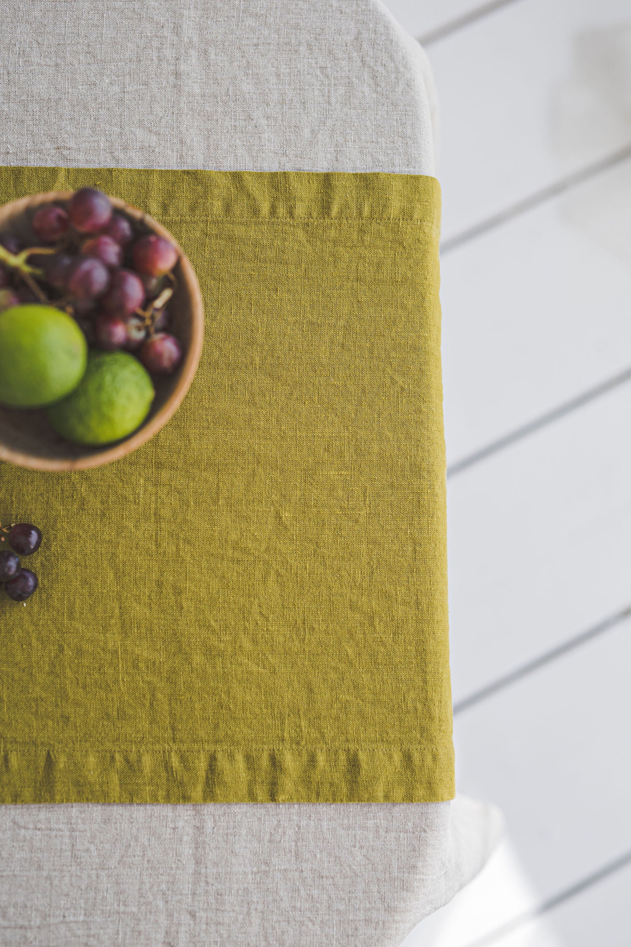 Olive green linen table runner with mitered corners