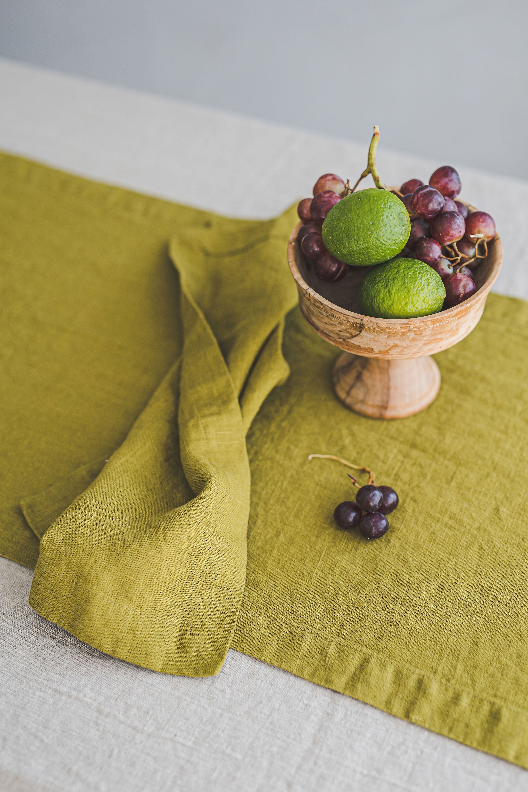 Olive green linen table runner with mitered corners