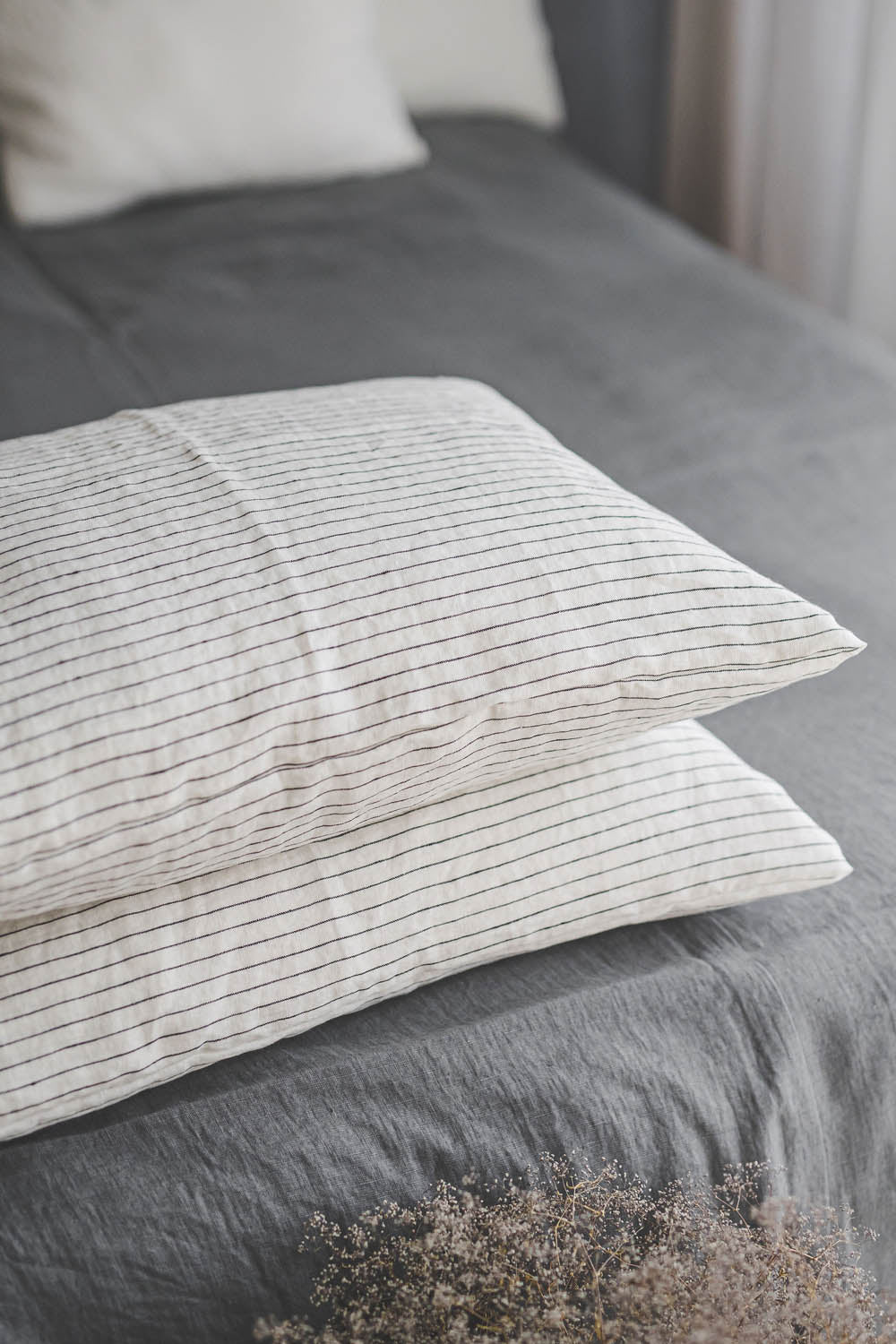 White linen pillowcase with black stripes