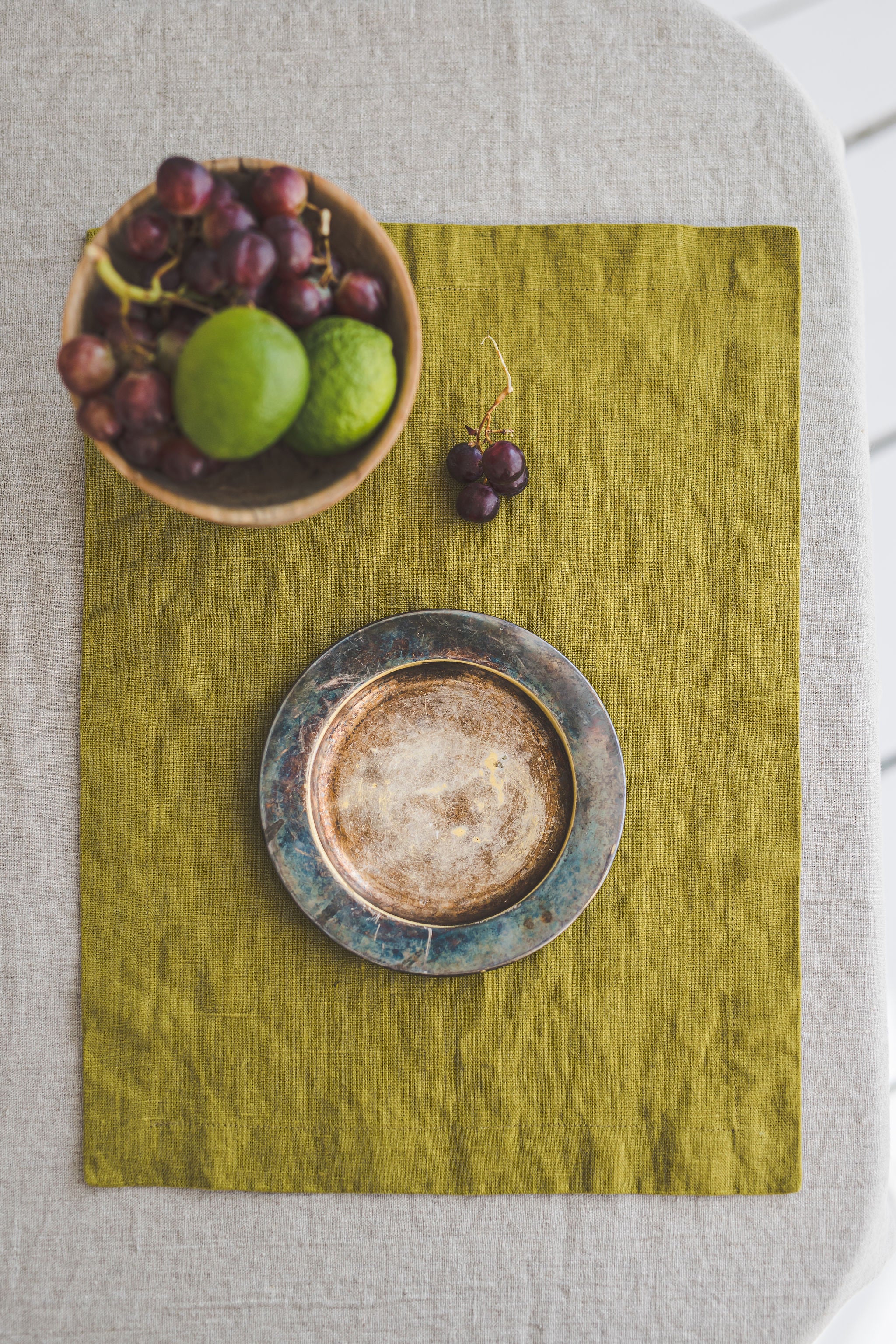 Olive green linen placemats with mitered corners