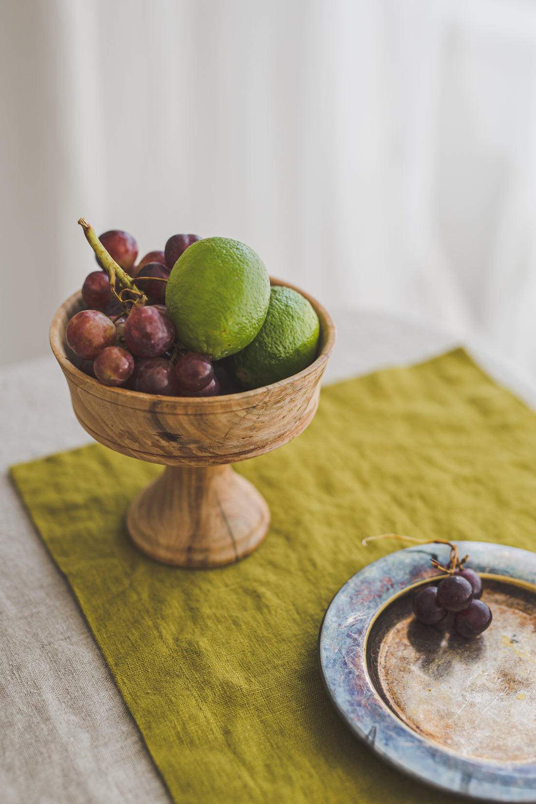 Olive green linen placemats with mitered corners