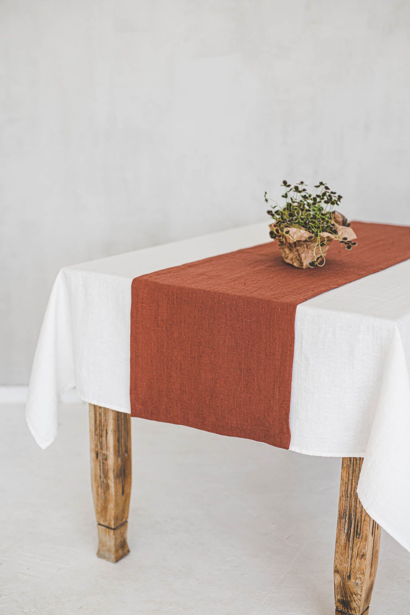 Burnt orange linen table runner with mitered corners