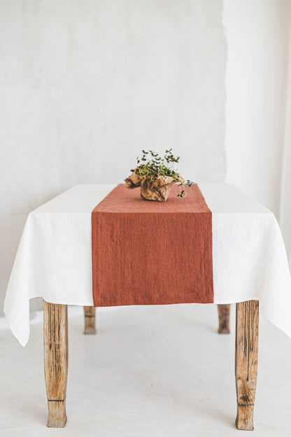 Burnt orange linen table runner with mitered corners