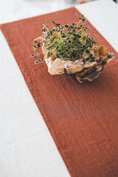 Burnt orange linen table runner with mitered corners