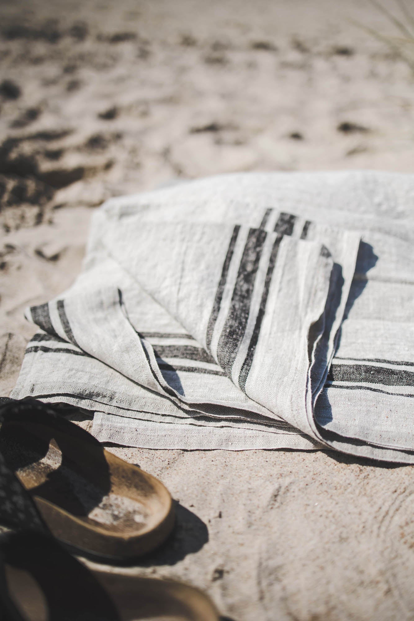 Linen beach towel with black stripes