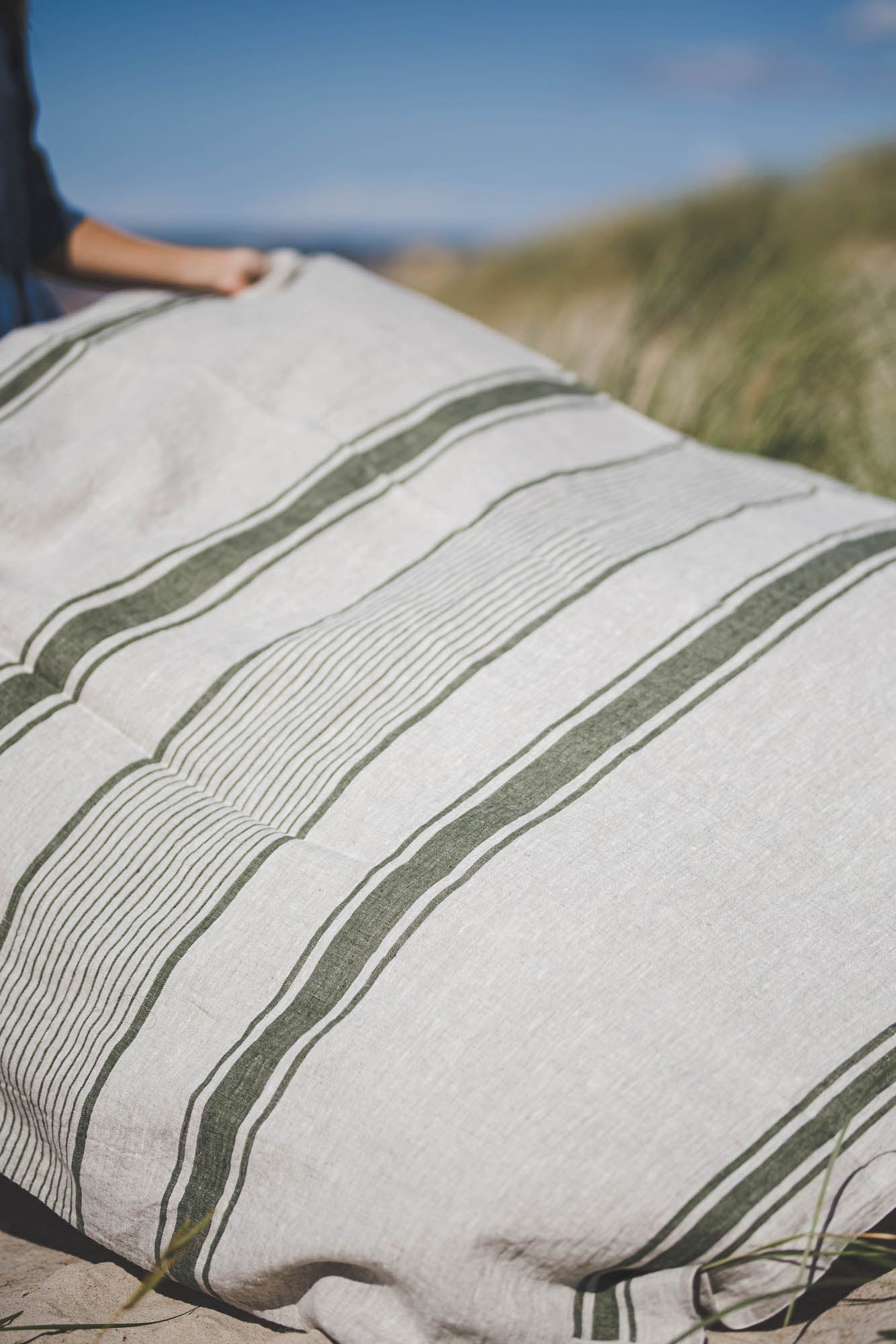 Linen beach towel with green stripes